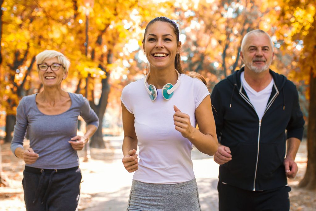 people jogging through a park