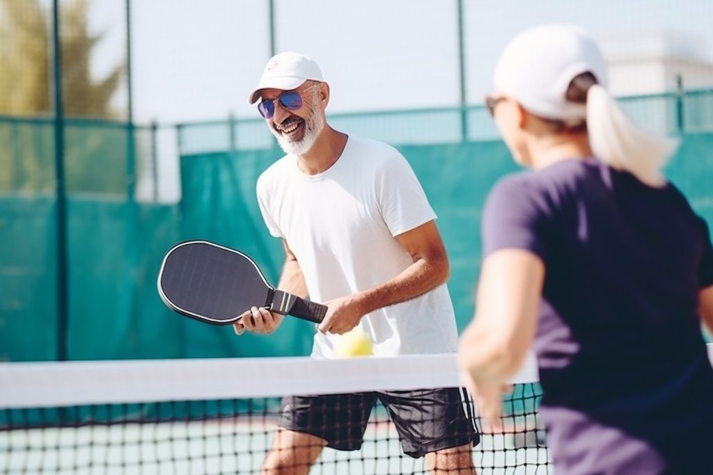 Close up of a man playing Pickleball